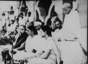 Gandhi in prayer c. January 1948, shortly before his assassination; photographer unknown; courtesy of commons.wikimedia.org